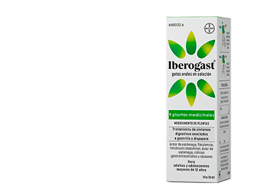 A bottle of Iberogast on green background, surrounded by herbs